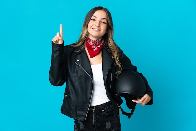 Woman holding a motorcycle helmet isolated pointing up a great idea