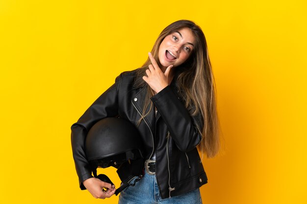 Woman holding a motorcycle helmet isolated