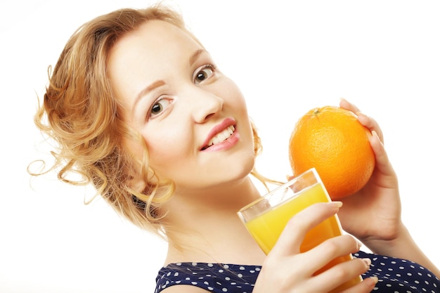 Woman holding orange over white background