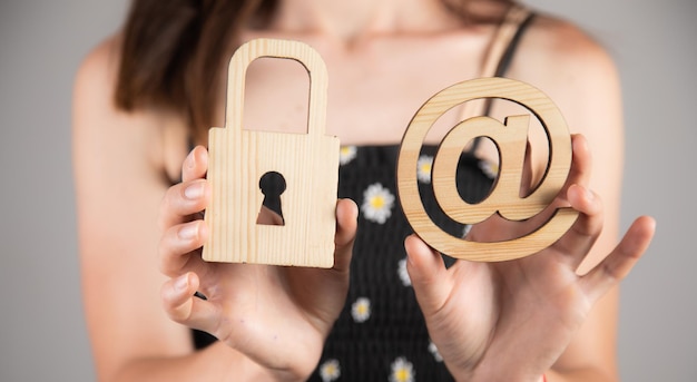 Photo woman holding padlock email symbol