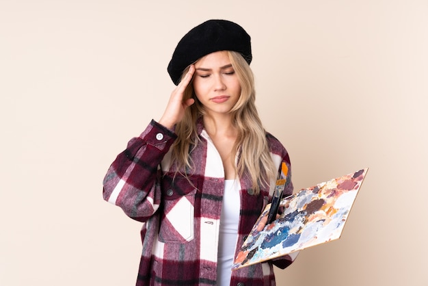 Woman holding a palette in studio