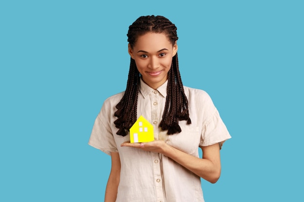 Woman holding paper house in hand real estate agency accommodation buying own house