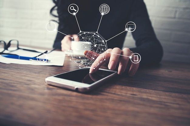 Woman holding phone with social media network in screen