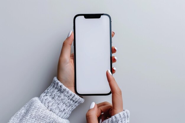 Photo a woman holding a phone with a white screen that says quot lg quot on the bottom