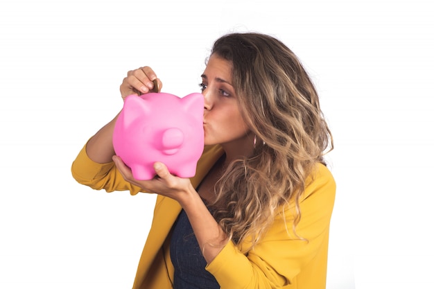 Woman holding a piggy bank