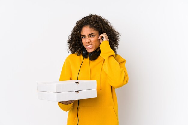 Woman holding pizza boxes