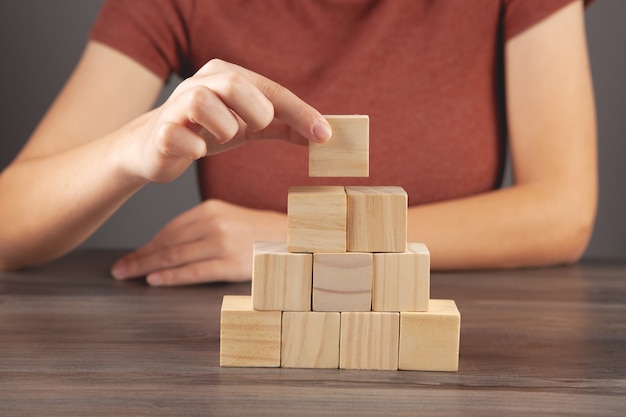 Woman holding a pyramid of cubes