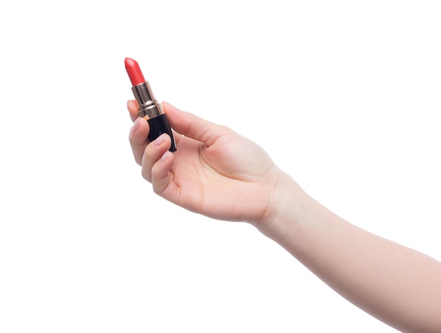 Woman holding red lipstick in her hand over white backround