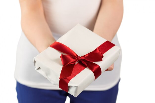 Woman holding red and white gift