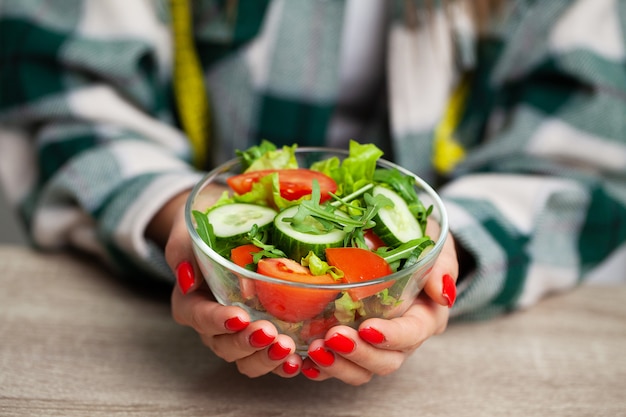 Woman holding a salad in her hands for a healthy lifestyle