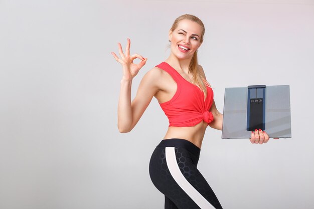 Woman holding scales in hands