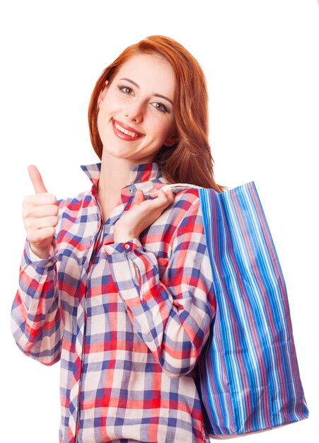 Woman holding shopping bags and smiling