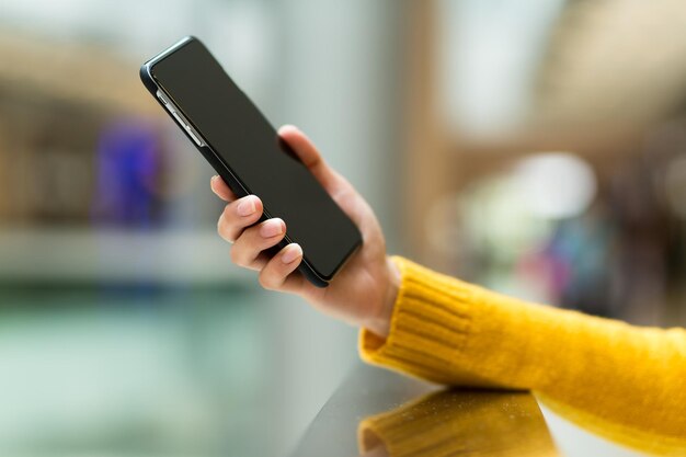 Woman holding smart phone