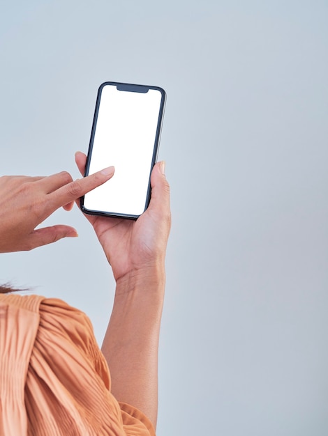 Woman holding smartphone in hands