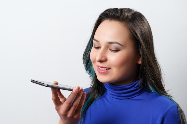 Woman holding a smartphone and talking