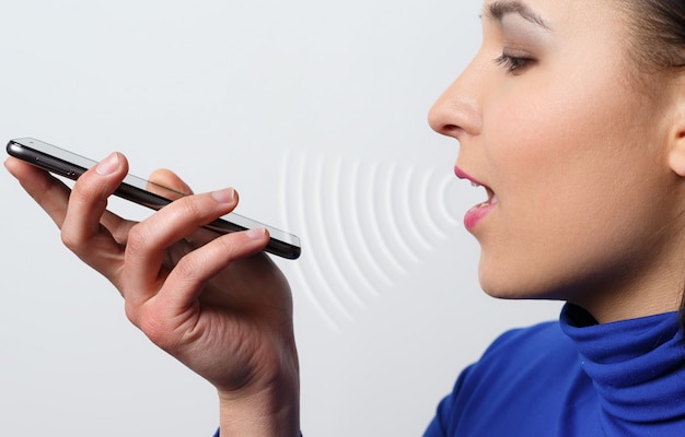 Woman holding a smartphone and talking