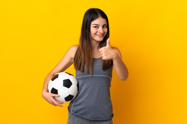 Woman holding a soccer ball