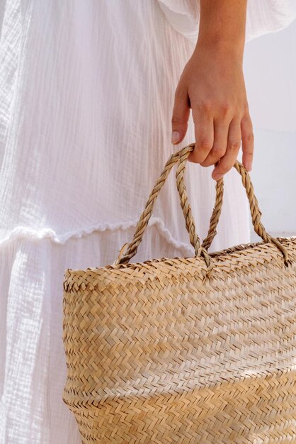 Woman holding straw basket