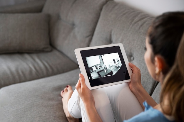 Woman holding tablet close up