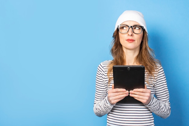 Woman holding a tablet in her hands