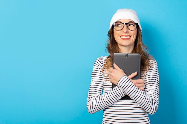 Woman holding a tablet in her hands