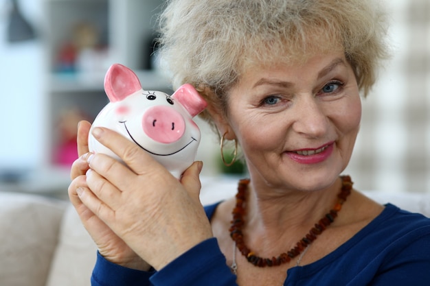 Woman holding thrift-box