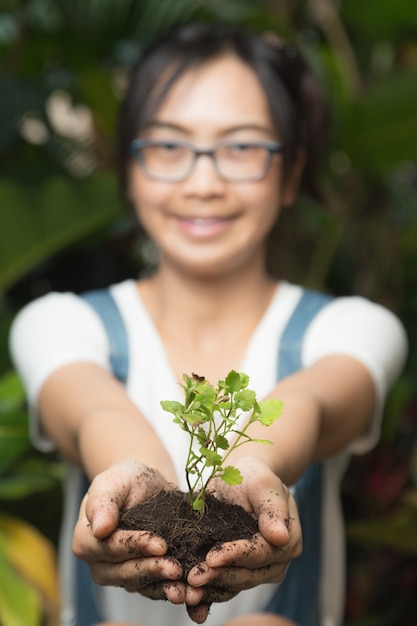 Woman Holding Tree