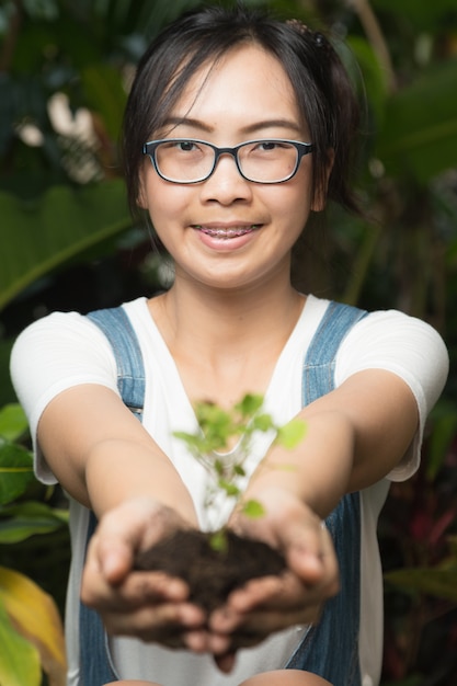 Woman Holding Tree