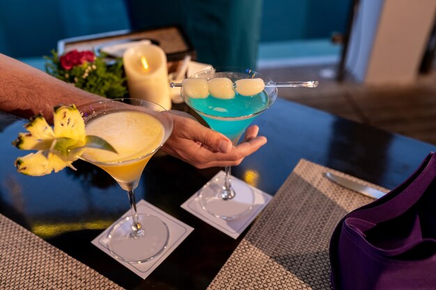 Woman holding tropical cocktail drinks