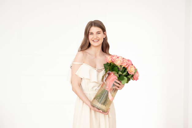 Woman holding a vase of flowers