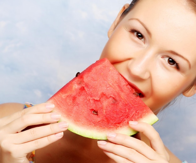 Woman holding watermelon