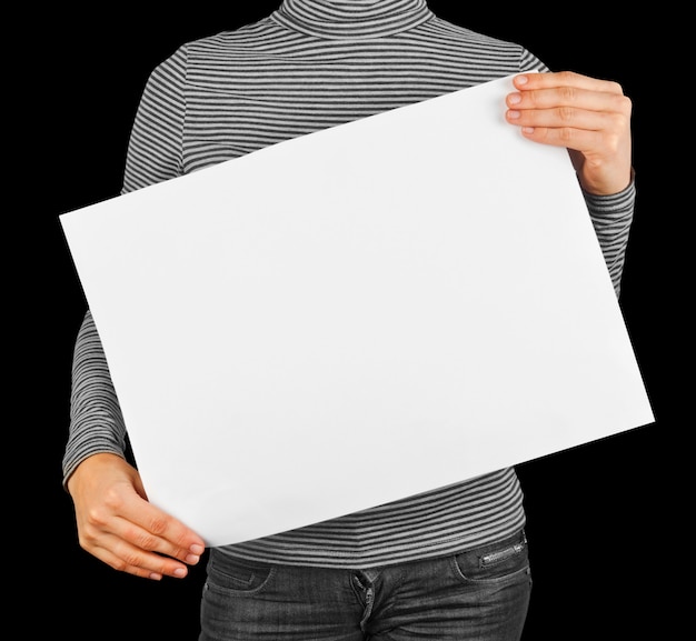 Woman holding white paper