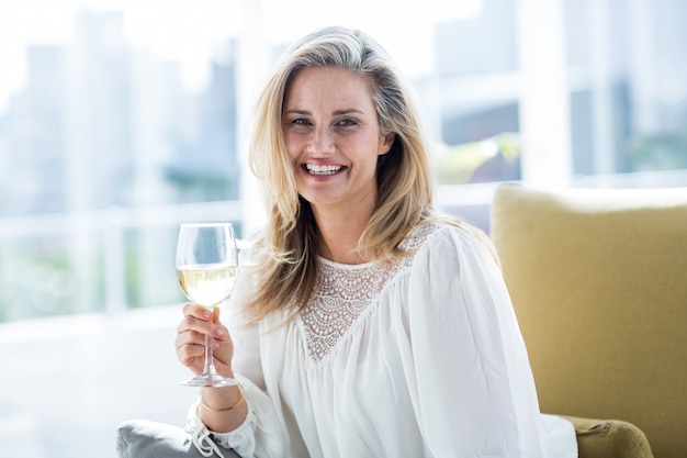 Woman holding wineglass at home