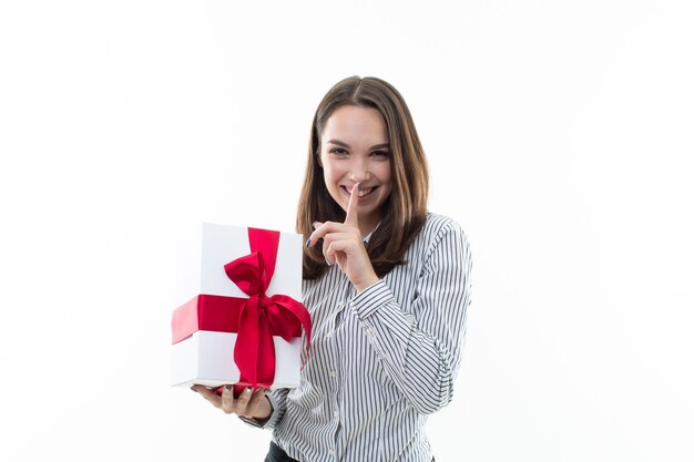 Woman holding a wrapped gift box with ribbon isolated