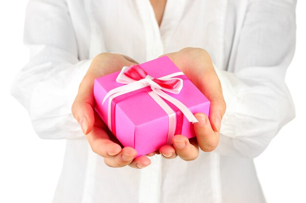 Woman holds a box with a gift on white background close-up