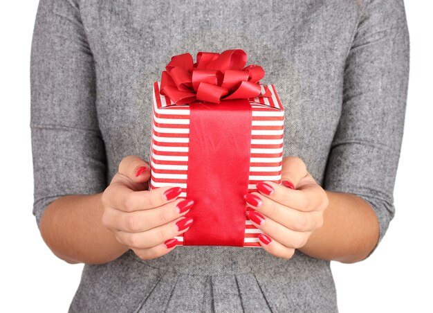 Woman holds  box with gift on white background close-up