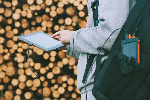 Woman holds her finger in front of blank tablet screen