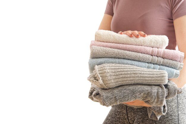 Premium Photo  Stack of clean towels on wooden table in bedroom