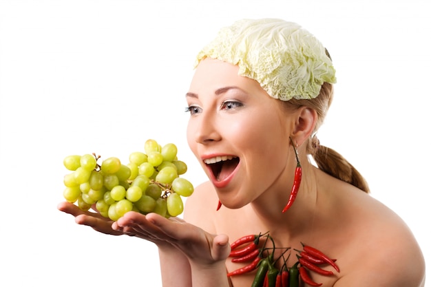 Woman holds ripe green grape in hands