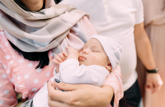 Woman holds sleeping baby tightly arms life