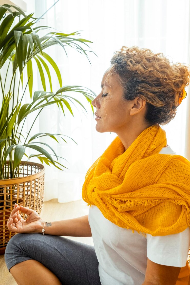 Photo woman at home doing yoga and meditation for physical and mental wellbeing incorporating daily stretching exercises breathing techniques and relaxation movements to maintain balance