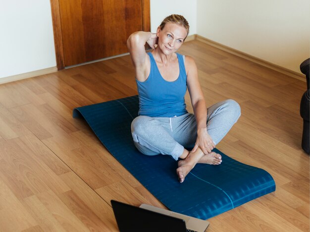 Woman at home exercising during quarantine