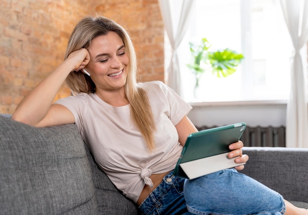 Photo woman at home having videocall with family