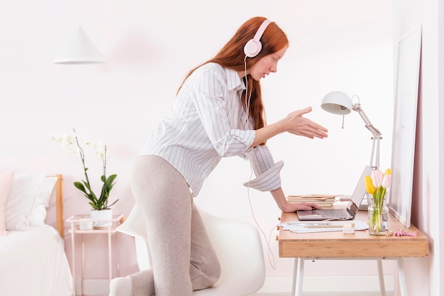 Woman at home working on laptop