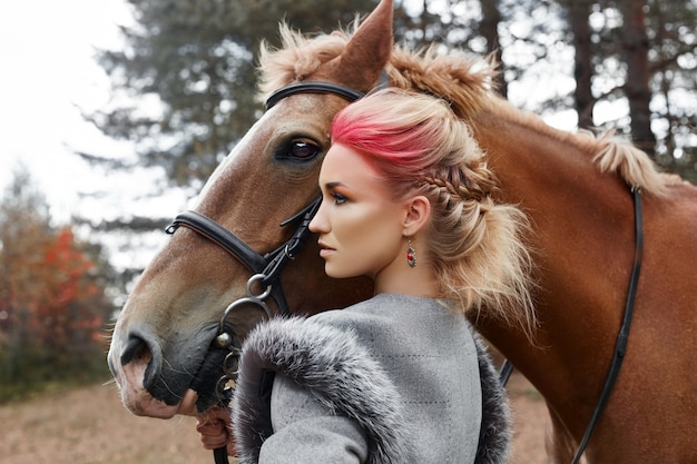 Woman on a horse in the fall. Creative makeup