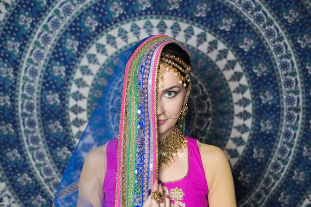 Woman in indian costume with jewellery and makeup