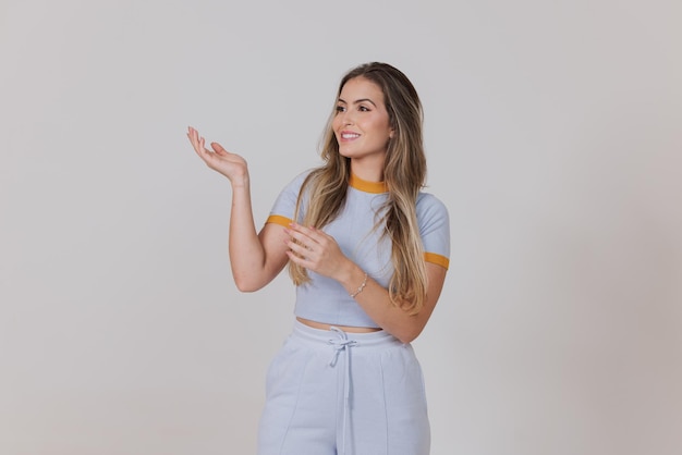 Photo woman indicating with hands, showing something, smile, poster girl