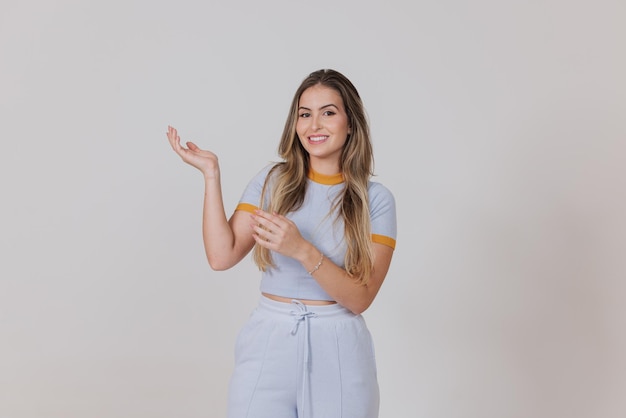 Woman indicating with hands, showing something, smile, poster girl