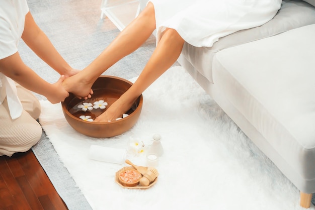 Woman indulges in blissful foot massage at luxurious spa salon Quiescent