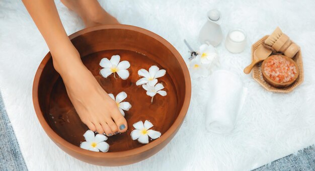 Woman indulges in blissful foot massage at luxurious spa salon Quiescent